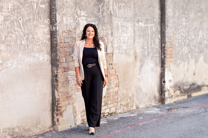 Real estate agent professional headshot in downtown McKinney, Texas