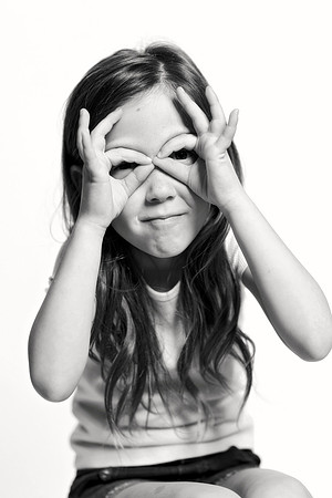 Black and white portrait of boy flexing