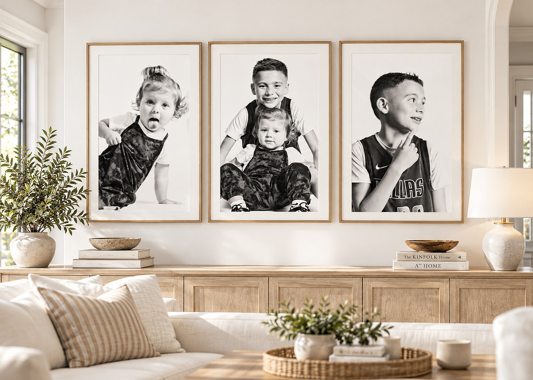 Framed personality portraits displayed on a bright gallery wall