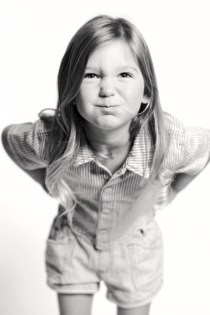 Black and white personality portrait of smiling boy