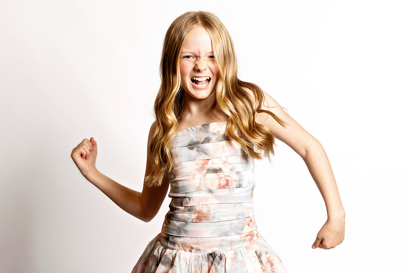 Expressive personality portrait of a girl in a floral dress